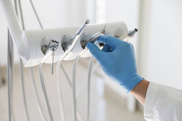 Professional Tooth Extraction technician working in Audubon County County, IA
